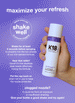 Airwash dry shampoo bottle being shaken on a purple background. 