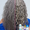 Grey curly hair before and after results using k18. 